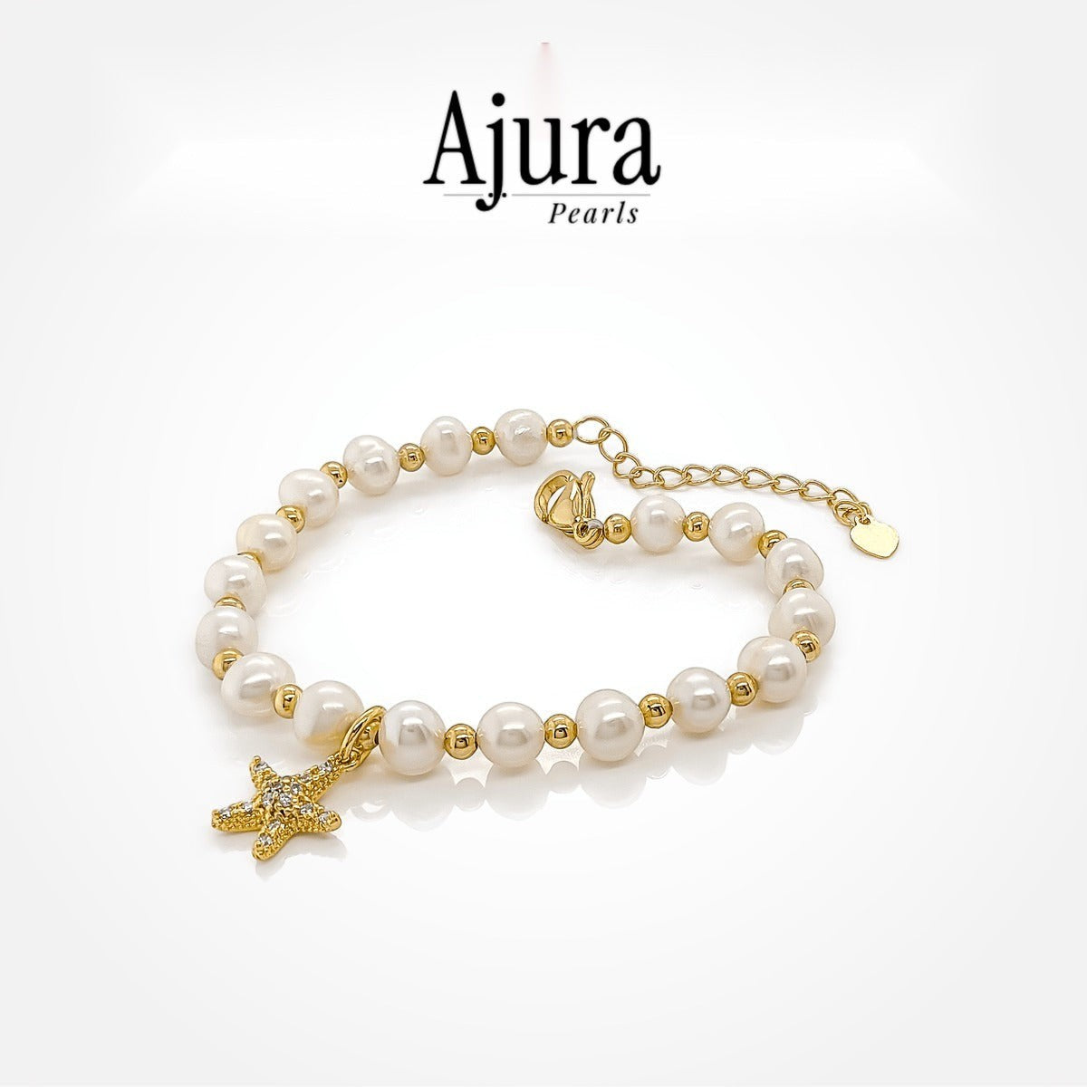 Ajura Pearls lavender freshwater pearl bracelet with starfish charm and gold bead accents.