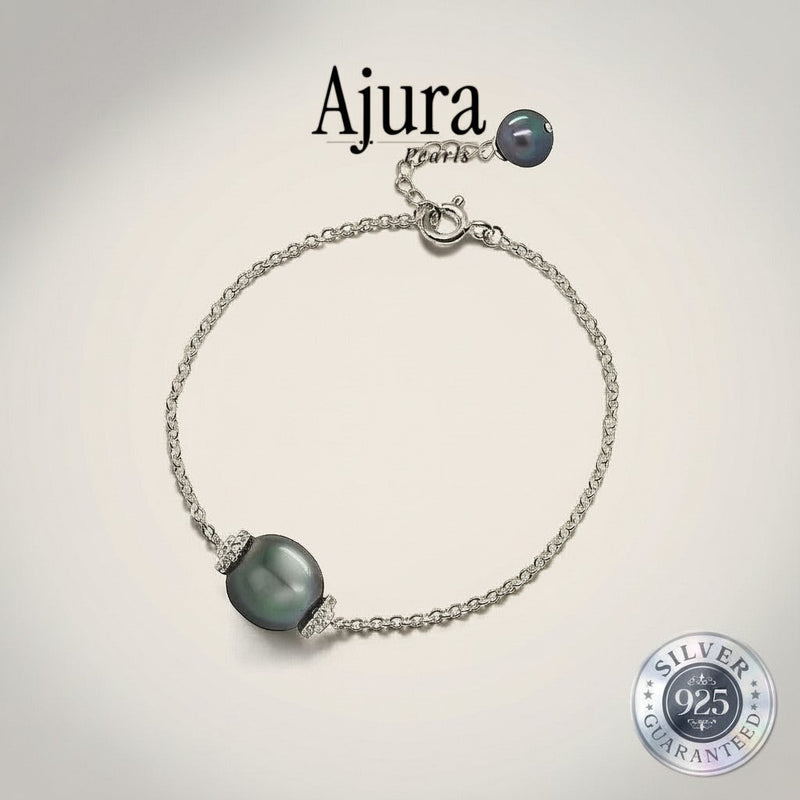 Ajura Pearls 925 sterling silver bracelet with a single dark grey Tahitian pearl and small clear crystals.