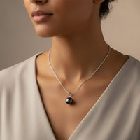 Ajura Pearls black freshwater pearl pendant on a 925 sterling silver chain. 8-9mm round pearl.