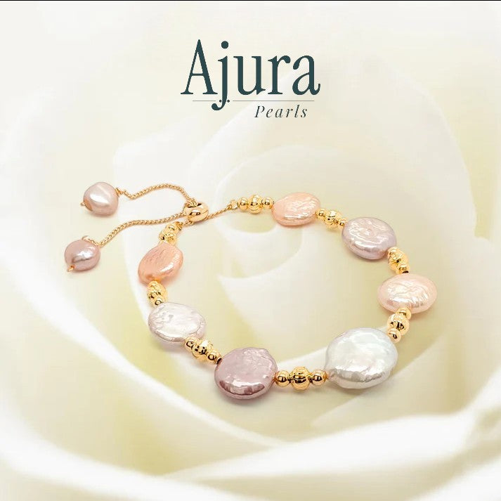 Ajura Pearls bracelet with mixed colour freshwater coin pearls and gold beads. Adjustable slider clasp.