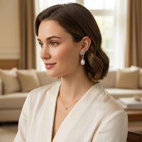 Ajura Pearls sterling silver drop earrings with double heart design and freshwater pearl.