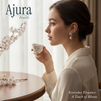 Ajura Pearls white gold plated floral drop earrings with pink freshwater pearls and yellow diamond accents.