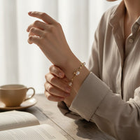 Ajura Pearls gold rhodium plated bracelet with off-round freshwater pearls and gold beads.