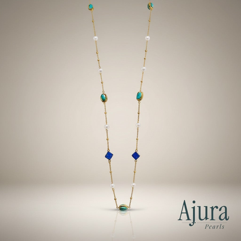 Ajura Pearls long necklace with lapis lazuli, turquoise, and freshwater pearls on a gold chain.