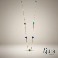 Ajura Pearls long necklace with lapis lazuli, turquoise, and freshwater pearls on a gold chain.