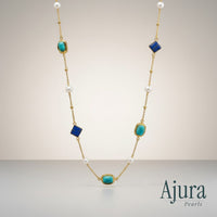 Ajura Pearls necklace with lapis lazuli, turquoise, and freshwater pearls on a gold chain.