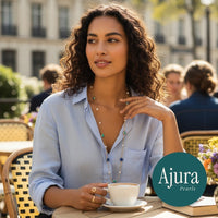 Ajura Pearls long necklace with lapis lazuli, turquoise, and freshwater pearls on a gold chain.