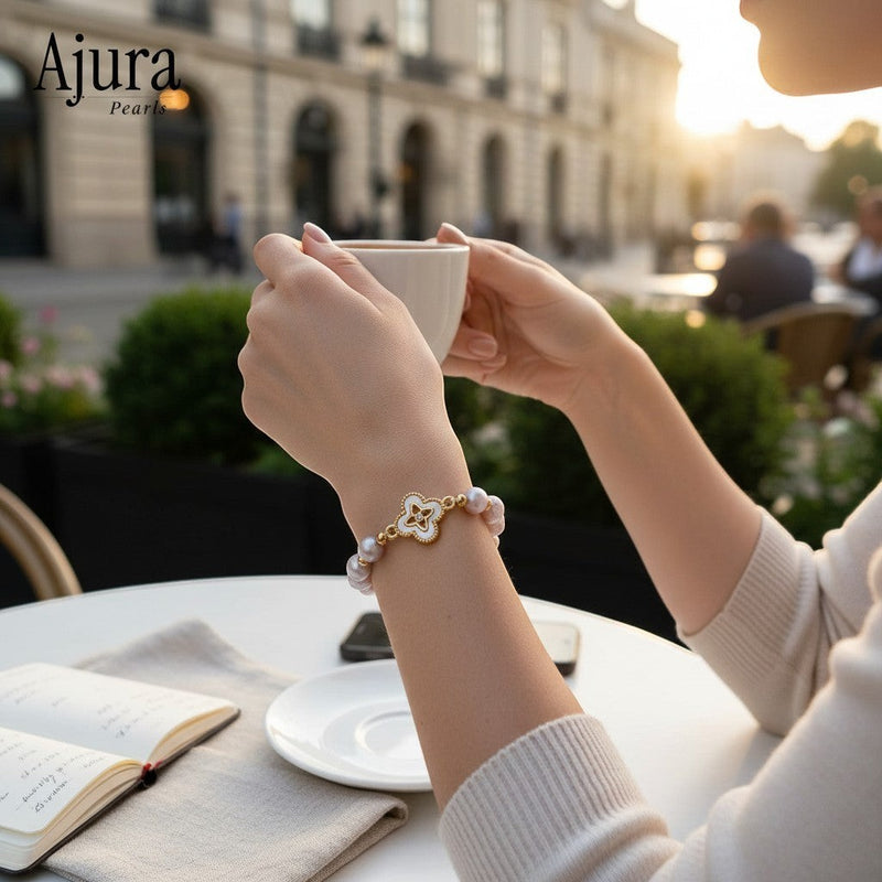 Ajura Pearls lavender freshwater pearl bracelet with gold accents and a clover-shaped mother-of-pearl charm.