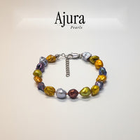 Ajura Pearls multicolor keshi pearl bracelet with unique, luminous, organically shaped pearls and silver clasp.