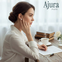Ajura Pearls peach freshwater pearl heart stud earrings in 925 silver with small accent stones.