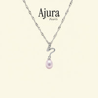 Ajura Pearls Stream Of The Wild pendant with a pink drop freshwater pearl and cubic zirconia accents on a white gold chain.