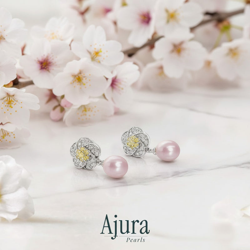 Ajura Pearls pink freshwater pearl drop earrings with floral motif and yellow center stones.