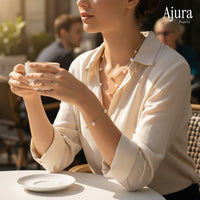 Ajura Pearls white freshwater pearl tin cup necklace and bracelet set on gold rhodium plated chain.