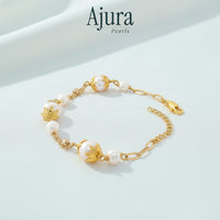 Ajura Pearls white freshwater potato pearl bracelet with gold-plated accents and chain.