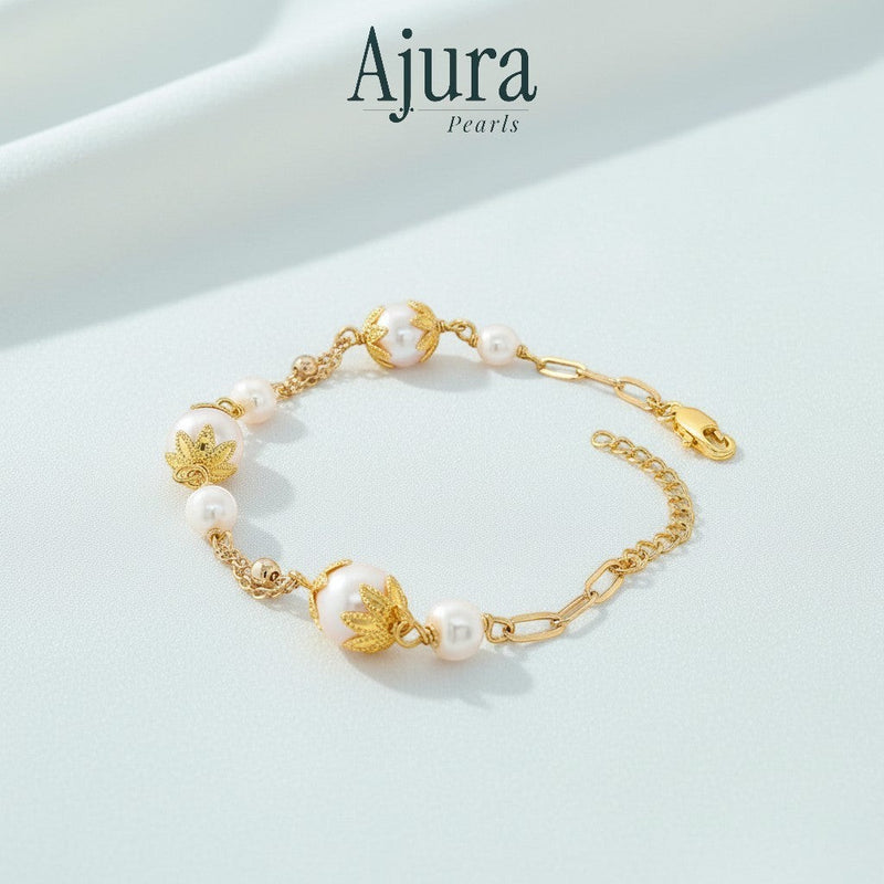 Ajura Pearls white freshwater potato pearl bracelet with gold-plated accents and chain.
