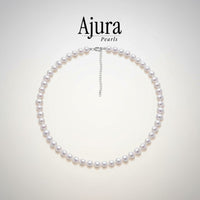 Ajura Pearls white freshwater pearl choker with off-round 6-7mm pearls and silver clasp with extension.