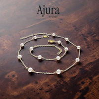 Ajura Pearls white freshwater pearl tin cup necklace and bracelet set on gold rhodium plated chain.