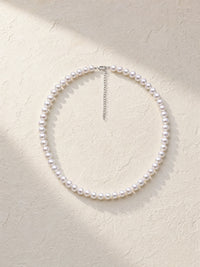 Classic Off Round Pearl Choker — light styled detail