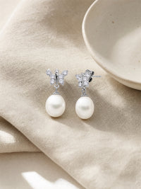 Dainty Butterfly Pearl Earring — light styled detail